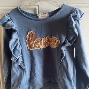 Between 2 pc set. Blue ruffle top and pants with butterfly’s